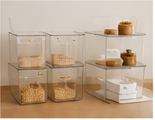Clear storage bins on pantry shelves